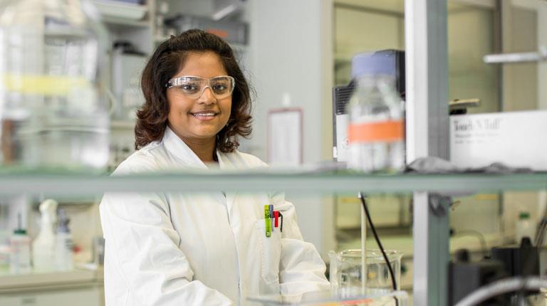 Lady in the lab smiling